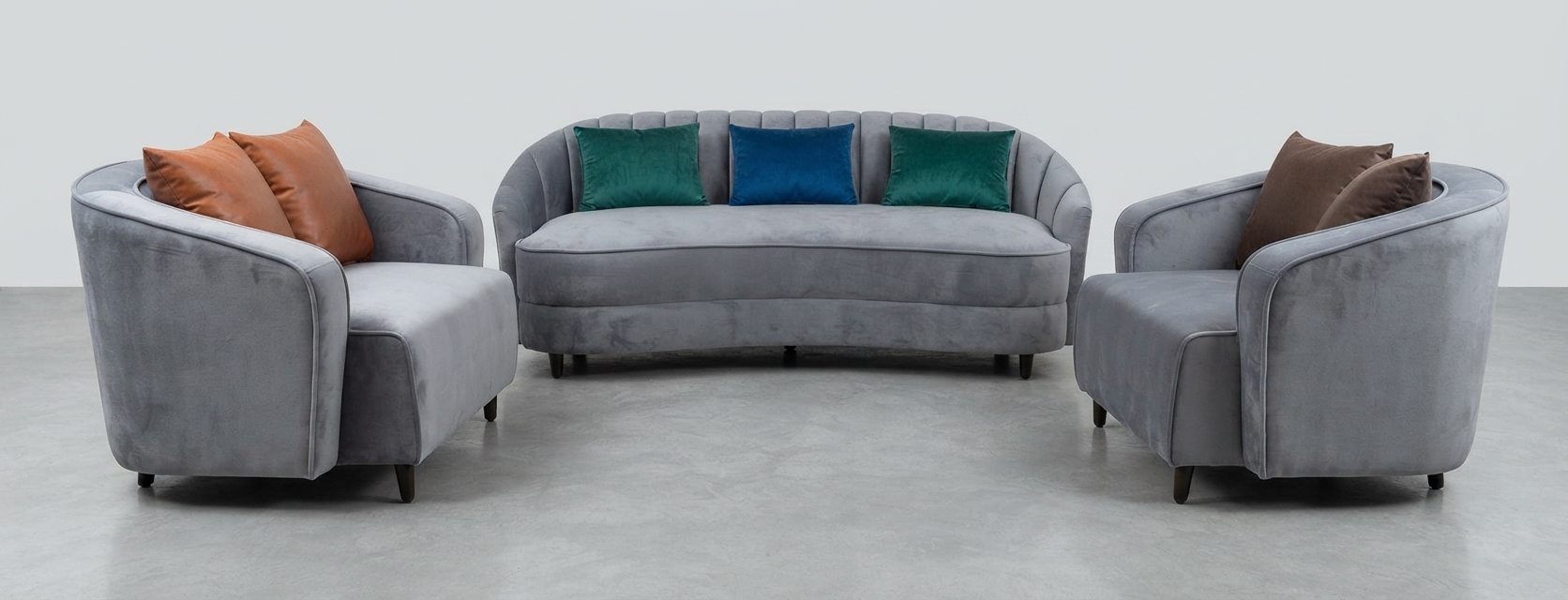 Grey velvet curved sofa with two armchairs