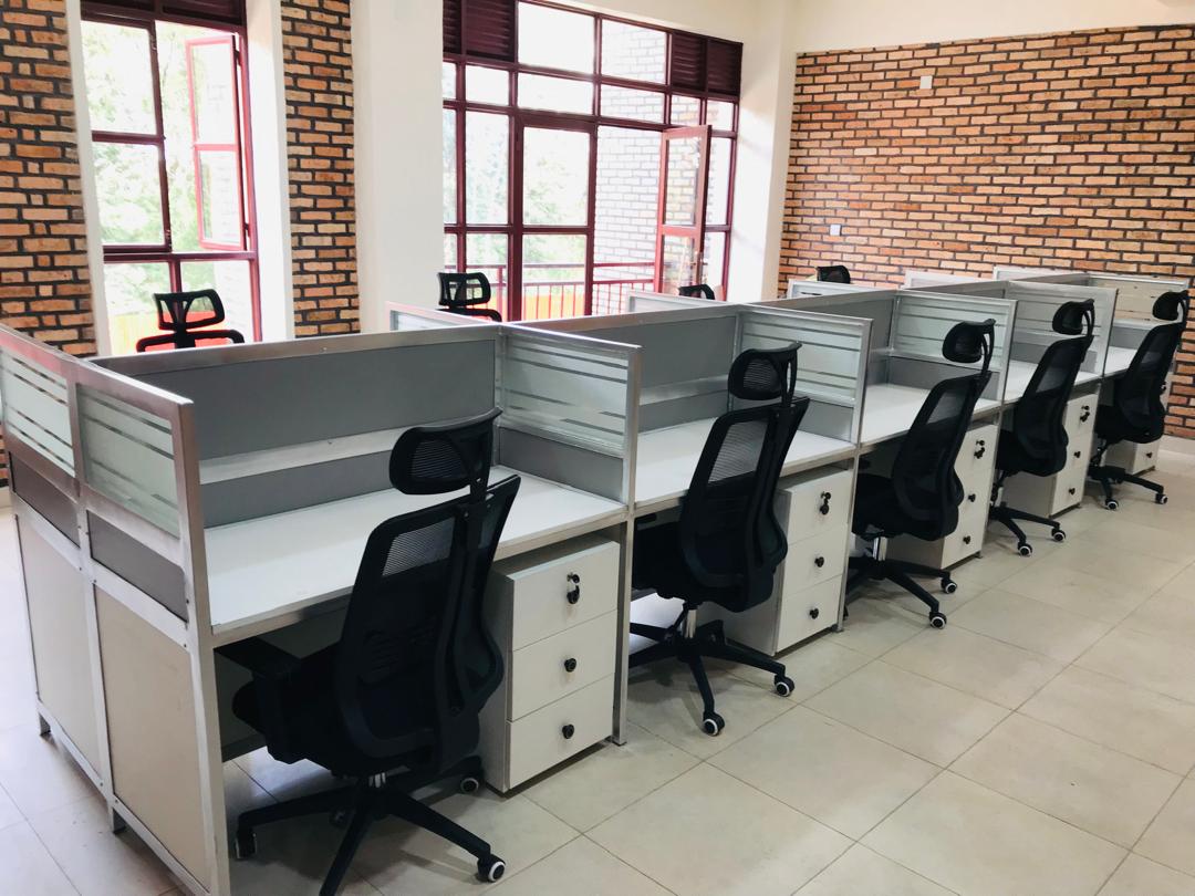 Rows of screened office workstations with task chairs