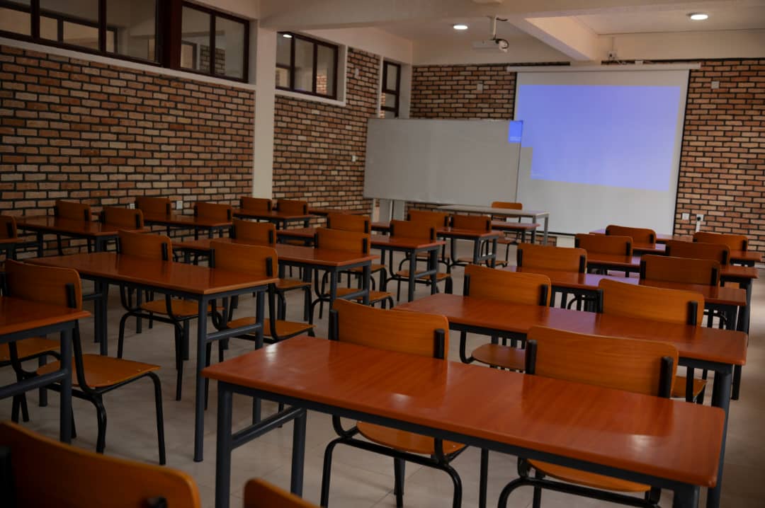 Classroom of wooden twin desks with steel frames